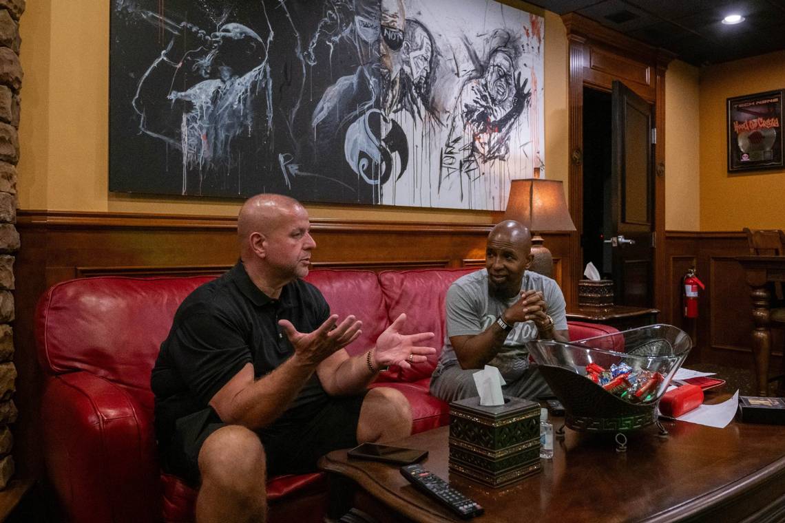 Travis O'Guin and Tech N9ne outside a Strange Music recording studio